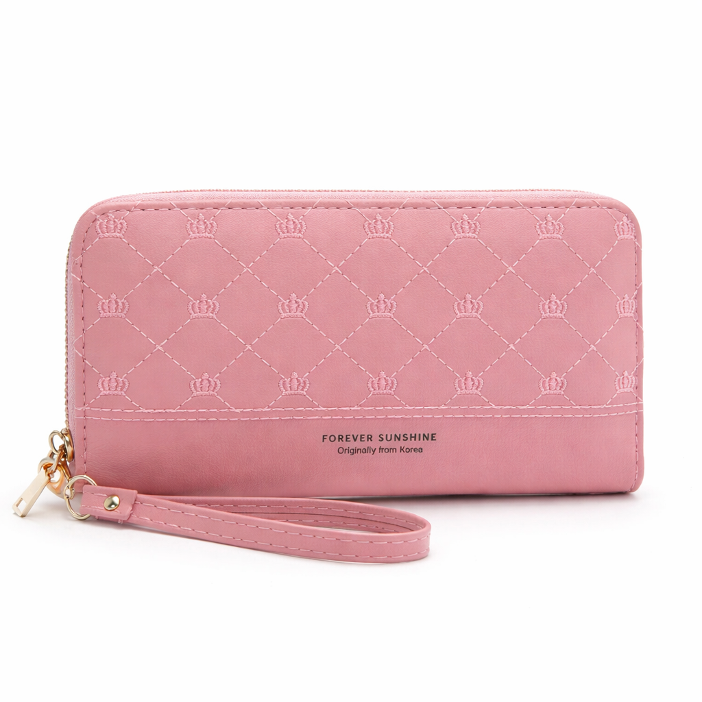 Pink quilted zip-around wallet with crown embroidery and wrist strap, standing upright on a white background, Korean-inspired pastel faux leather women’s clutch wallet for everyday use.