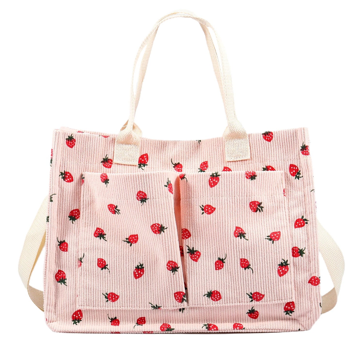 Pink strawberry print canvas tote bag with front pockets and cream shoulder straps, cute aesthetic shopper bag isolated on white background