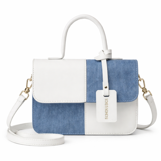 Two-tone white and denim blue structured satchel with top handle and crossbody strap on white background