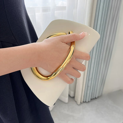 The Teryana Sculpted Gold Clutch