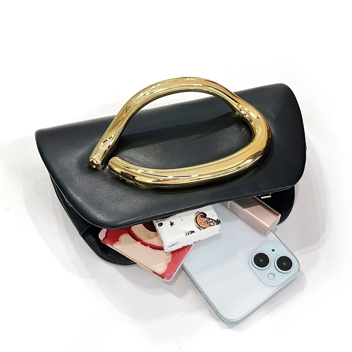 The Teryana Sculpted Gold Clutch