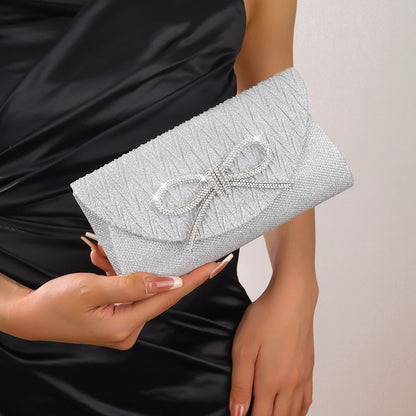 The Noir Éclat Satin Bow Clutch