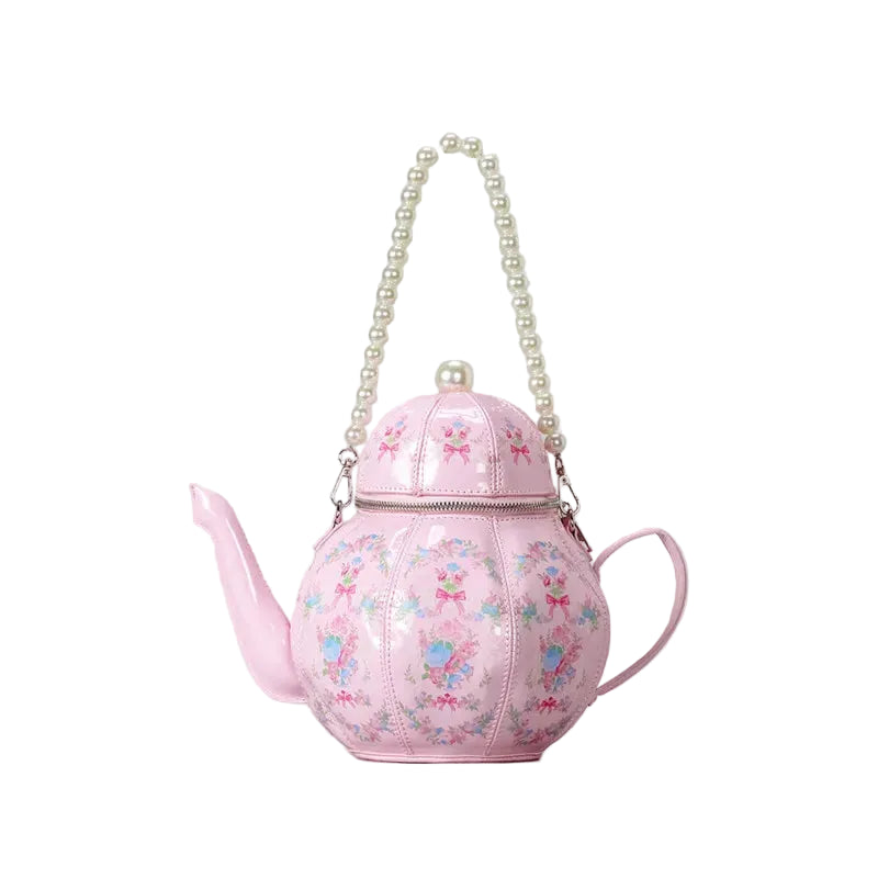 Pink teapot shaped novelty handbag with floral design and gold chain strap, whimsical women’s statement shoulder bag