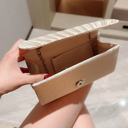 The Ivory Title Pleated Clutch