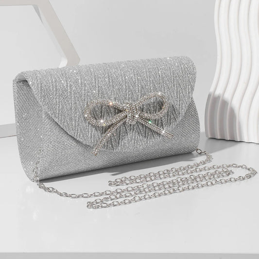 The Lumière Satin Bow Clutch