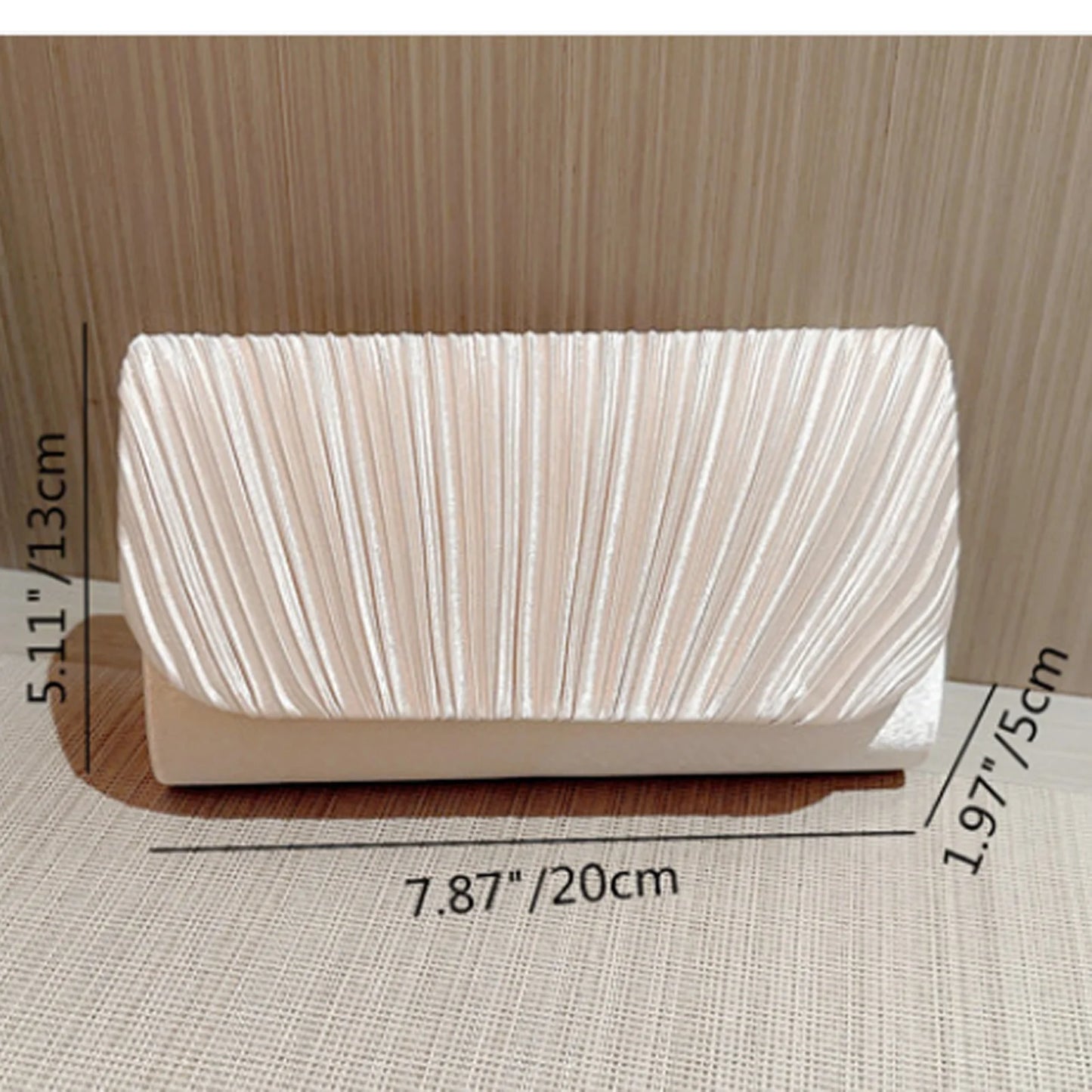 The Ivory Title Pleated Clutch