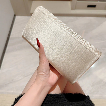 The Ivory Title Pleated Clutch
