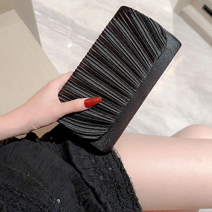 The Ivory Title Pleated Clutch