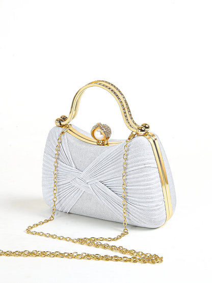 Silver textured evening clutch with gold top handle and chain strap, elegant women’s formal handbag for weddings and parties