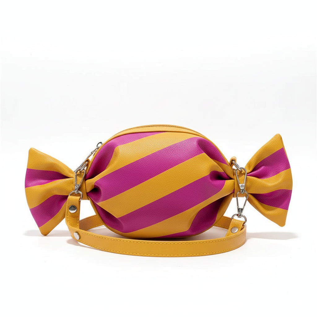 Candy shaped striped shoulder bag in pink and yellow with bow ends, playful women’s novelty handbag with geometric pattern
