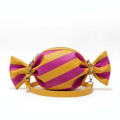 Candy shaped striped shoulder bag in pink and yellow with bow ends, playful women’s novelty handbag with geometric pattern