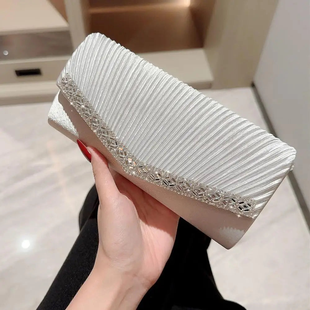 The Ivory Title Pleated Clutch