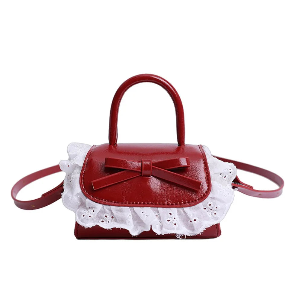 Red gathered satchel handbag with top handles and crossbody strap, elegant women’s everyday shoulder bag