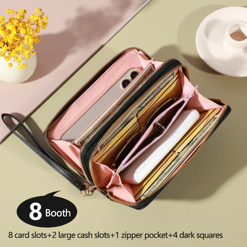 Open women long organizer wallet showing card slots zip coin pocket phone compartment and monogram exterior design