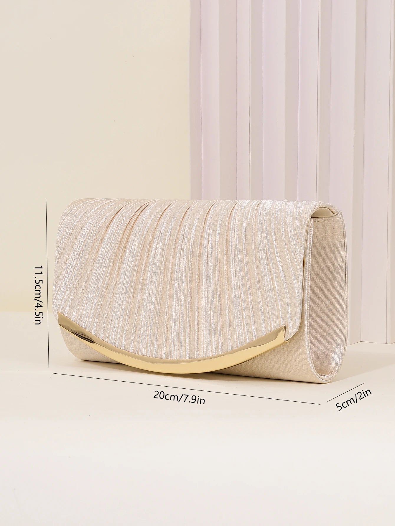 Silver pleated evening clutch with chain strap and curved flap design, elegant women’s formal handbag for weddings and parties