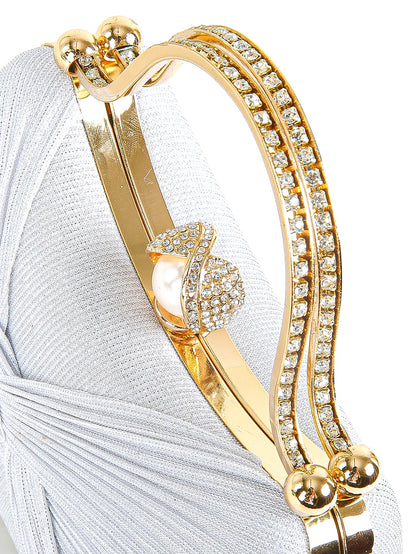 Structured evening clutch with sculptural handle and chain strap detail, luxury women’s party handbag with textured finish