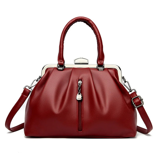 Red gathered satchel handbag with top handles and crossbody strap, elegant women’s everyday shoulder bag