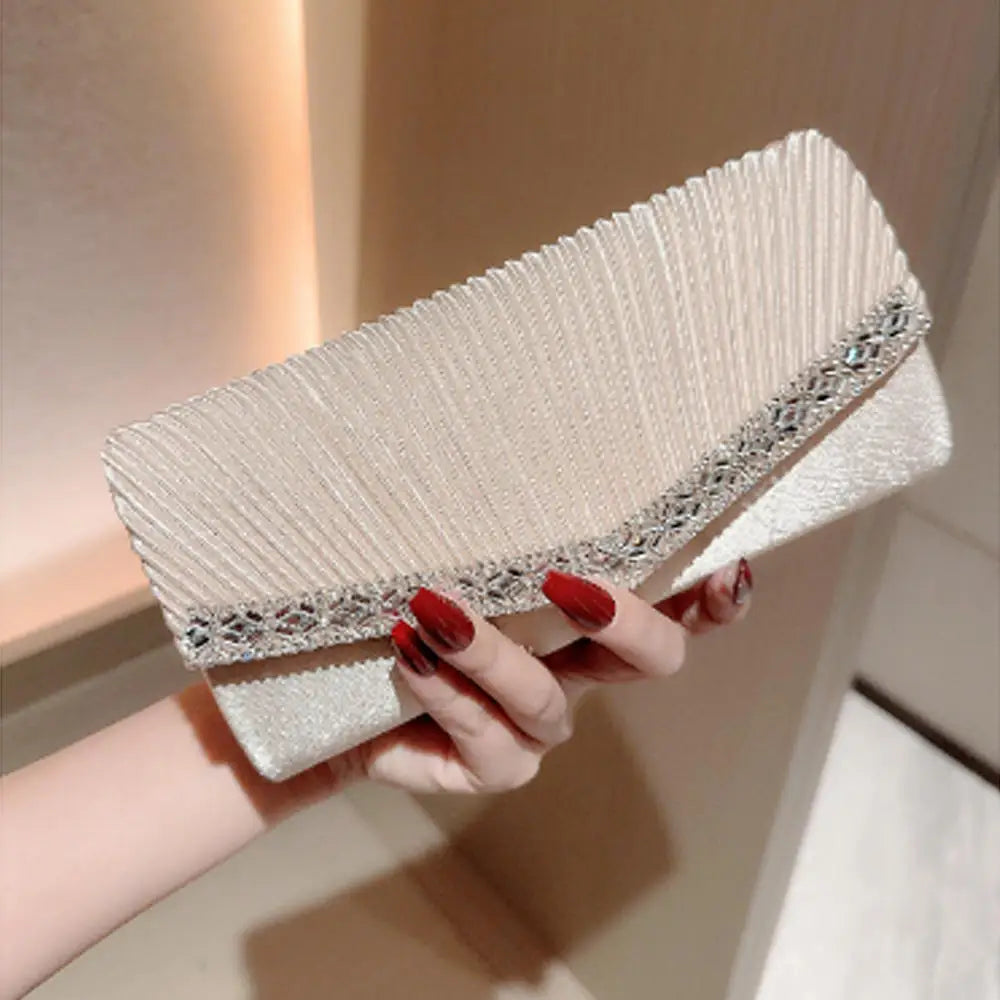The Ivory Title Pleated Clutch